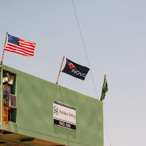 Novo flag blowing in the wind during drilling