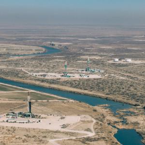 3 drilling rigs alongside the Pecos River outside of Carlsbad, NM